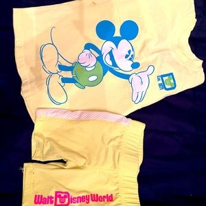 Disney! It’s neon yellow/ green kids spirit shirt and shorts.